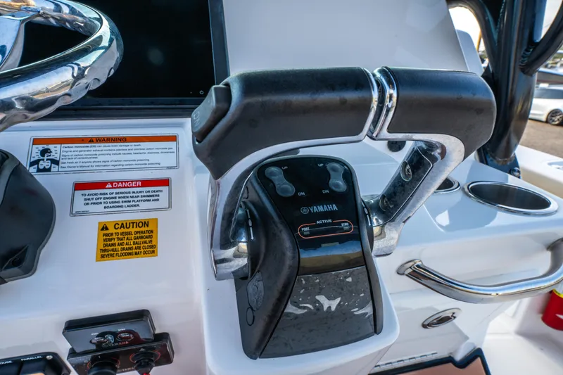 Slide: The Image of 2019 Everglades 273CC boat interior with open door revealing compact bathroom. - 43