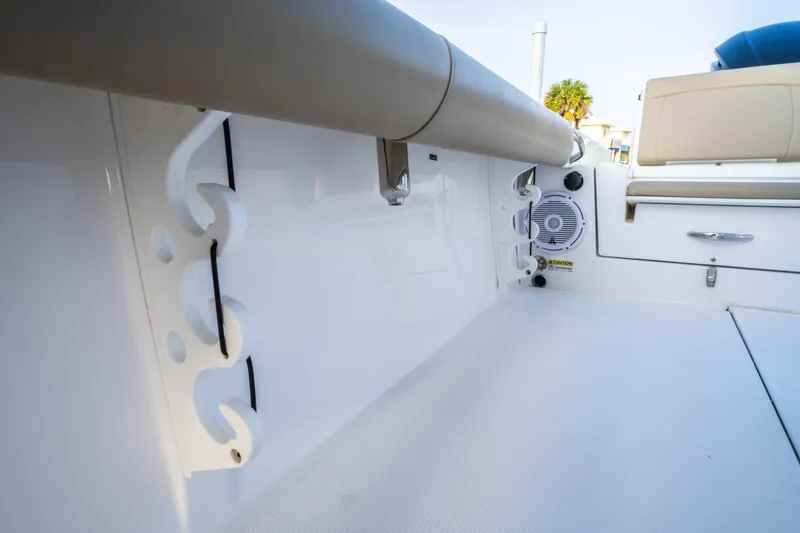 Slide: The Image of Front view of 2019 Everglades 273CC boat under clear blue sky. - 49