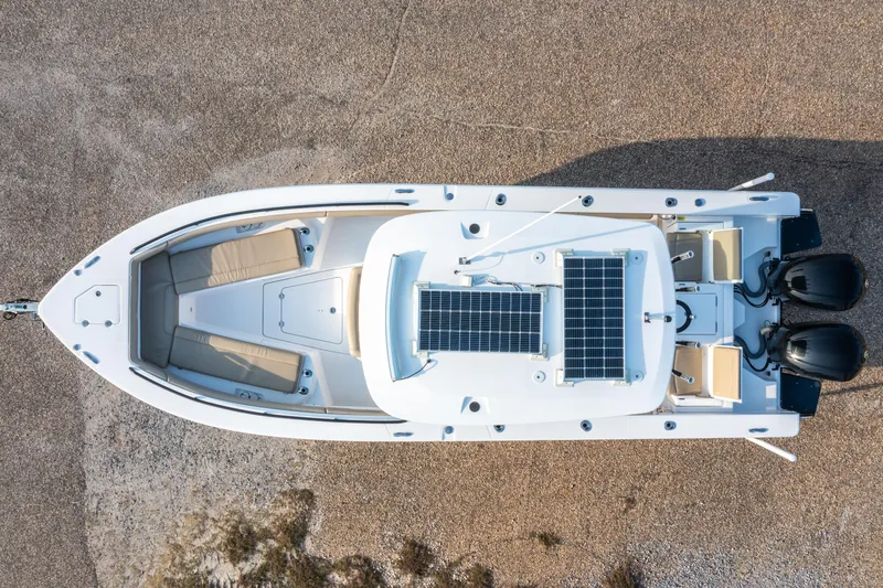 Slide: The Image of Overhead view of 2019 Everglades 273CC boat with dual engines and solar panels. - 5