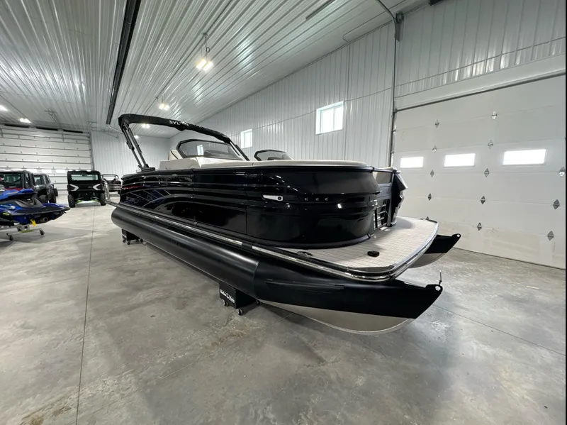 Slide: The Image of 2024 Sylvan G3 CLZ DC pontoon boat in a spacious indoor showroom. - 4