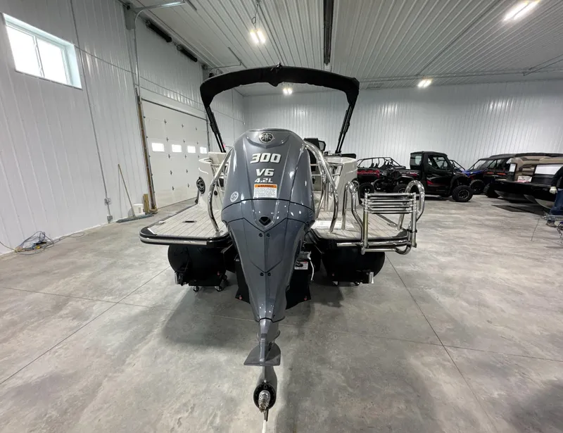 Slide: The Image of 2024 Sylvan G3 CLZ DC boat with 300 V6 engine in a spacious garage. - 5