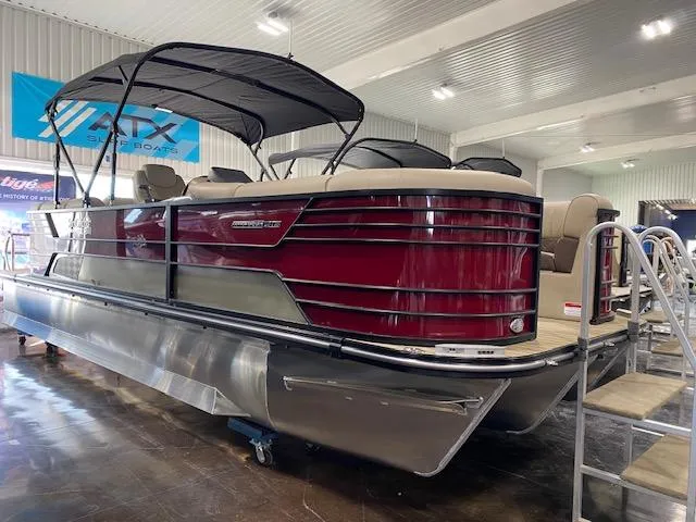 Slide: The Image of 2025 SunCatcher Elite 324 RC pontoon boat with sleek design in showroom. - 0