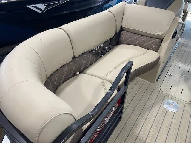 Slide: The Image of 2025 SunCatcher Elite 324 RC boat seating with beige upholstery and diamond-patterned accents. - 3