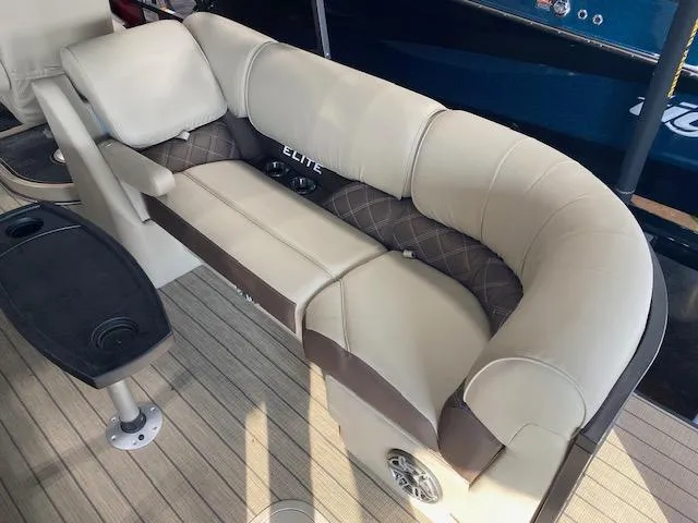 Slide: The Image of Luxurious seating on 2025 SunCatcher Elite 324 RC boat with beige upholstery. - 5