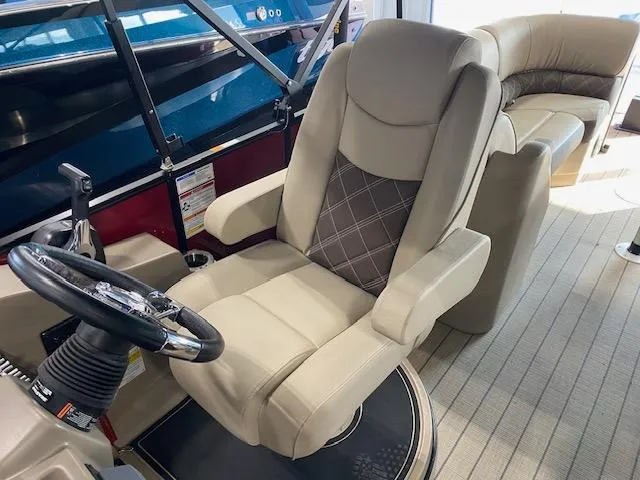 Slide: The Image of Luxurious interior of 2025 SunCatcher Elite 324 RC boat with plush seating. - 6