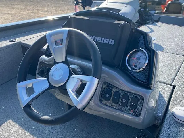 Slide: The Image of 2025 G3 Sportsman 1610 boat dashboard with steering wheel and control panel. - 3