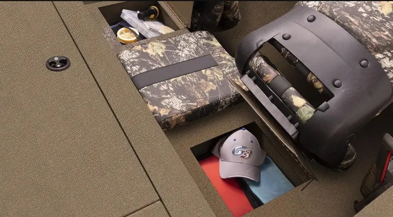 Slide: The Image of 2025 G3 Sportsman 1610 boat interior with camo seats and storage compartments. - 9