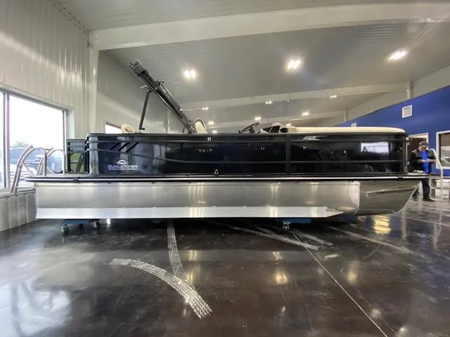 Slide: The Image of 2025 SunCatcher Select 322RF pontoon boat displayed indoors, side view. - 0