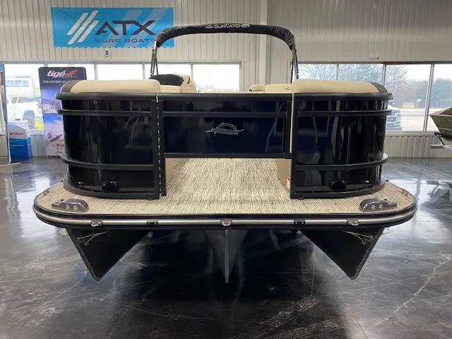 Slide: The Image of 2025 SunCatcher Select 322RF pontoon boat in showroom, front view. - 2