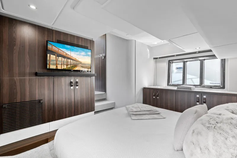 Slide: The Image of Luxurious bedroom interior of 2019 Azimut 50 Flybridge yacht with modern decor and TV. - 15