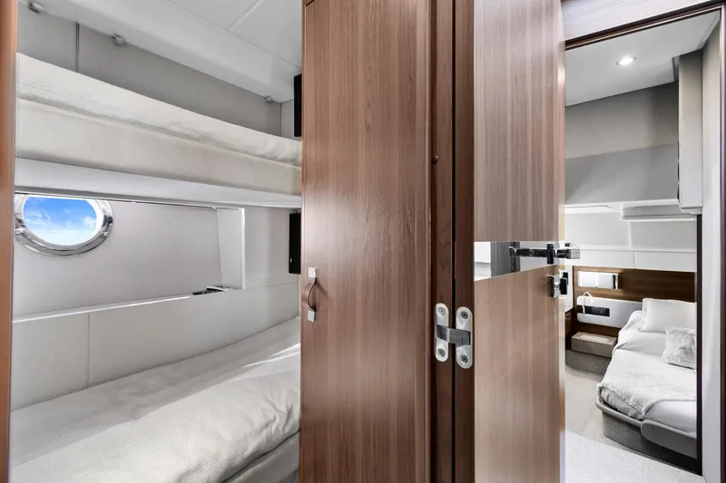 Slide: The Image of Interior of 2019 Azimut 50 Flybridge yacht with cozy bunk beds and modern design. - 20