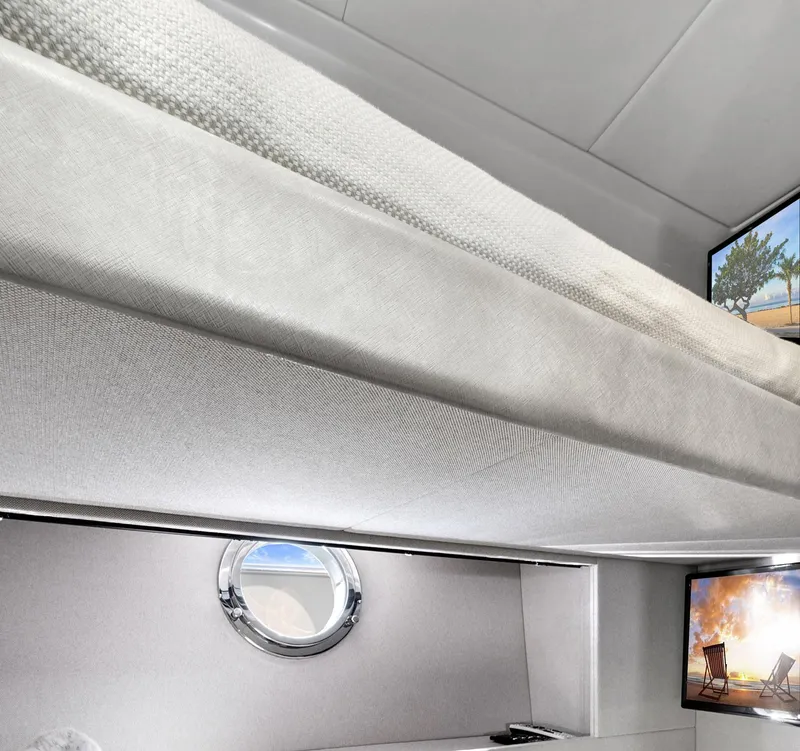 Slide: The Image of Interior of 2019 Azimut 50 Flybridge yacht with porthole and TV. - 21