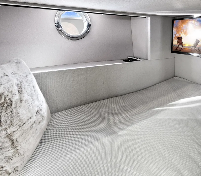 Slide: The Image of Luxurious cabin interior of 2019 Azimut 50 Flybridge yacht with porthole and TV. - 22