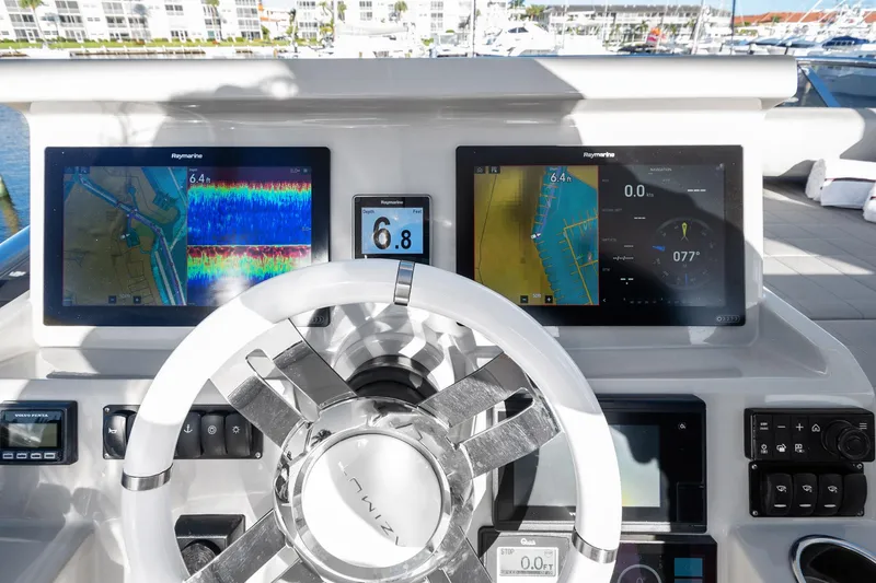 Slide: The Image of Helm of 2019 Azimut 50 Flybridge with advanced navigation displays and controls. - 32