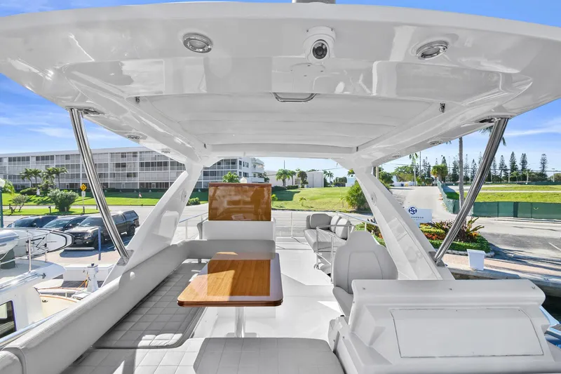 Slide: The Image of 2019 Azimut 50 Flybridge yacht interior with seating and table, showcasing luxury design. - 37