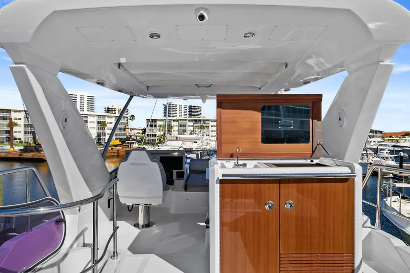 Slide: The Image of 2019 Azimut 50 Flybridge yacht interior with modern helm and cabinetry. - 38
