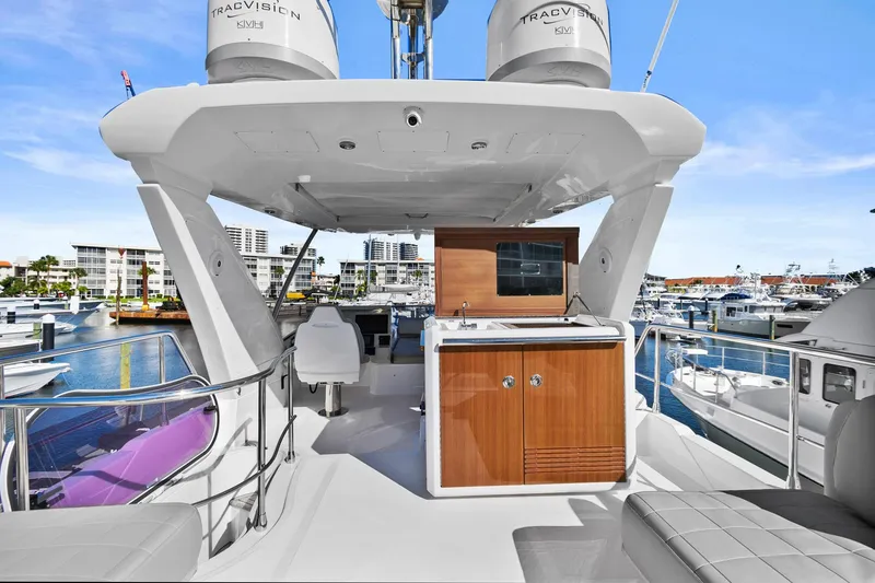 Slide: The Image of 2019 Azimut 50 Flybridge yacht with modern flybridge and marina view. - 39