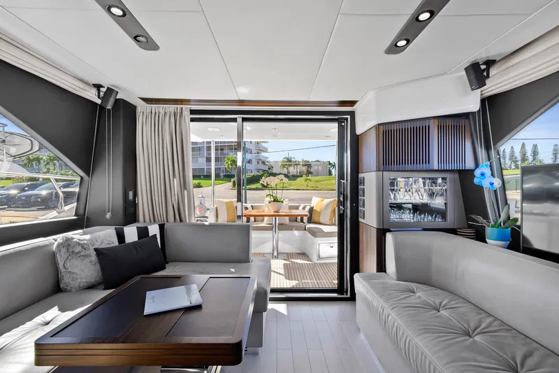 Slide: The Image of Luxurious interior of 2019 Azimut 50 Flybridge yacht with modern seating and elegant decor. - 4