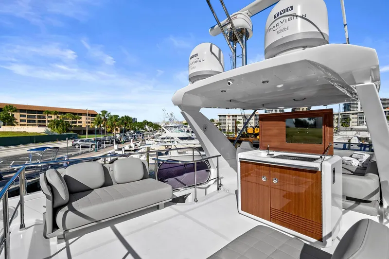 Slide: The Image of Azimut 50 Flybridge 2019 yacht with luxurious seating and entertainment area on deck. - 40