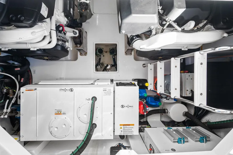 Slide: The Image of Engine room of 2019 Azimut 50 Flybridge yacht, showcasing mechanical components and systems. - 43