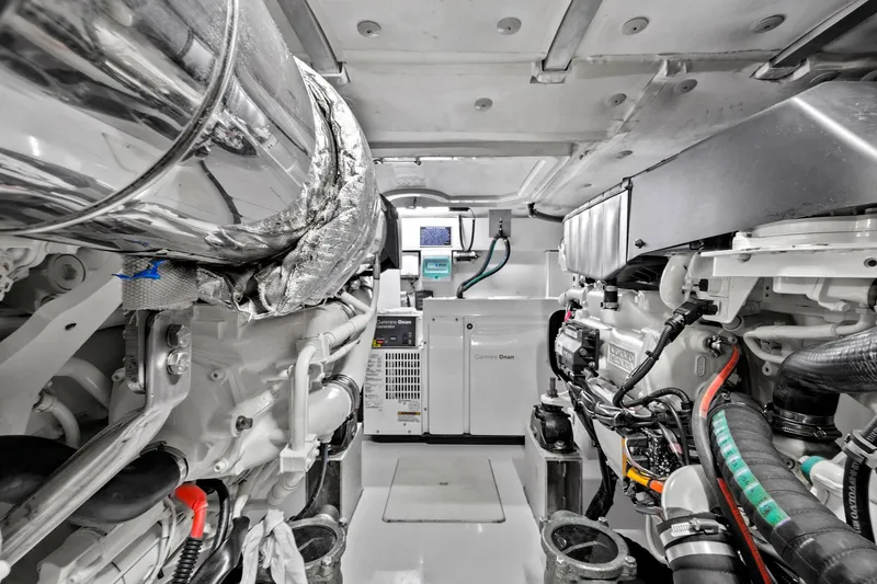 Slide: The Image of Engine room of 2019 Azimut 50 Flybridge yacht, showcasing mechanical components and systems. - 47
