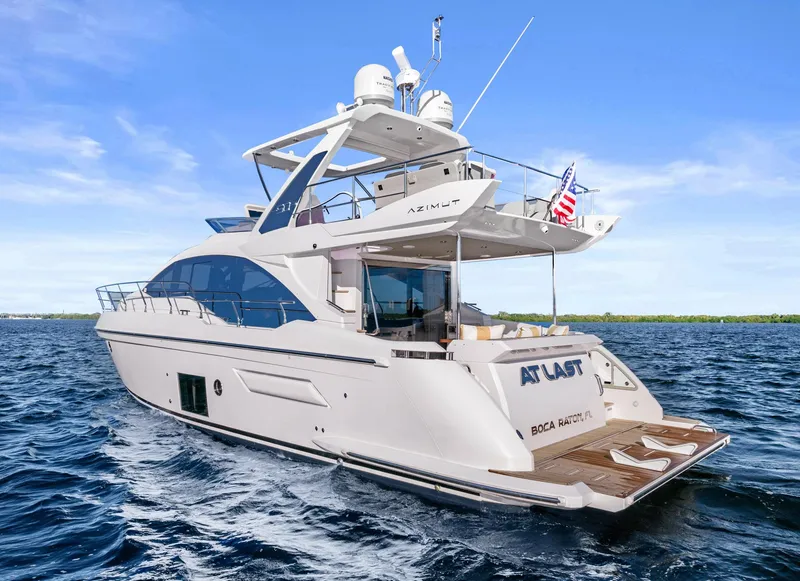 Slide: The Image of 2019 Azimut 50 Flybridge yacht cruising on open water, featuring sleek design and luxury amenities. - 49