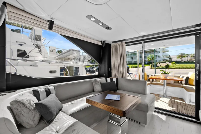 Slide: The Image of Luxurious interior of 2019 Azimut 50 Flybridge yacht with modern seating and dining area. - 5