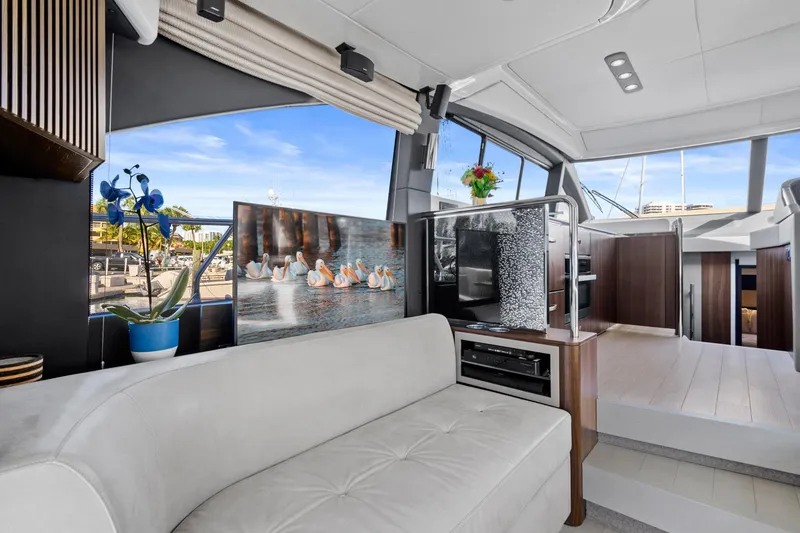 Slide: The Image of Luxurious interior of 2019 Azimut 50 Flybridge yacht with modern decor and comfortable seating. - 6