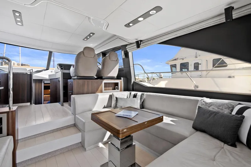 Slide: The Image of Luxurious interior of 2019 Azimut 50 Flybridge yacht with modern seating and table. - 7