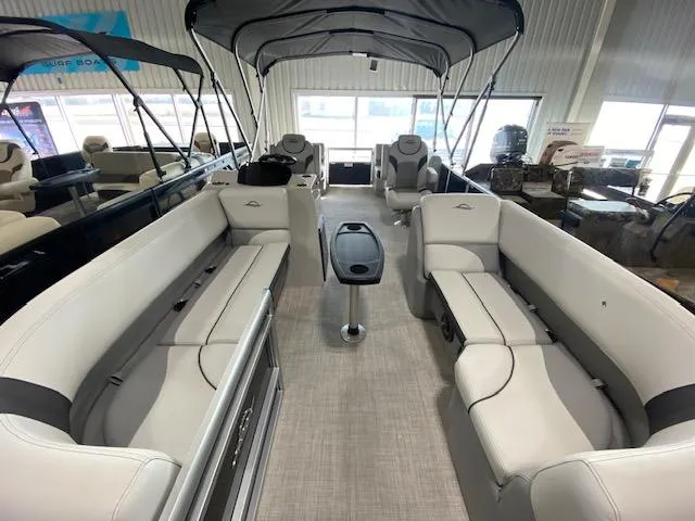 Slide: The Image of 2025 SunCatcher Select 320 RC pontoon boat interior with spacious seating and canopy. - 3