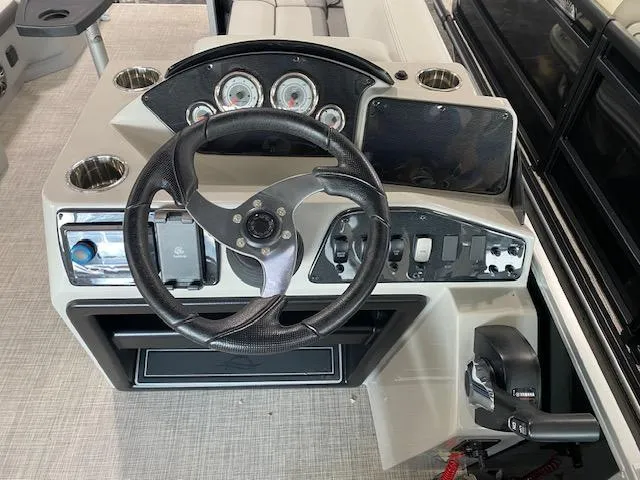 Slide: The Image of Steering console of 2025 SunCatcher Select 320 RC boat with gauges and controls. - 4