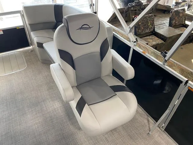 Slide: The Image of 2025 SunCatcher Select 320 RC boat interior with plush seating and modern design. - 6