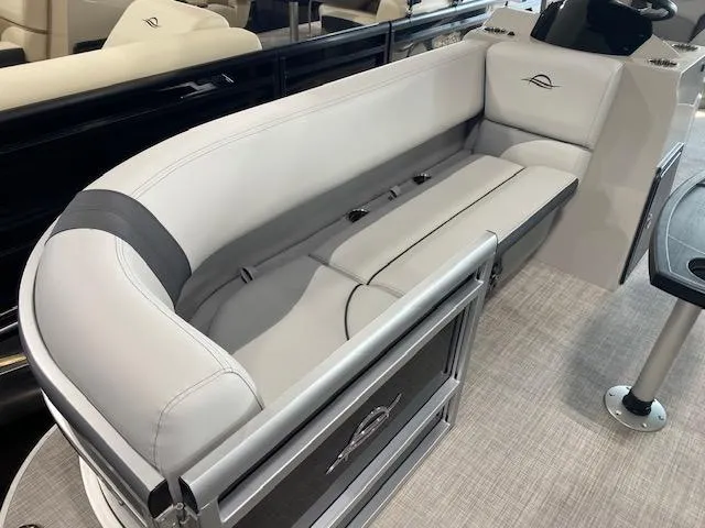 Slide: The Image of 2025 SunCatcher Select 320 RC boat interior with sleek, modern seating design. - 7