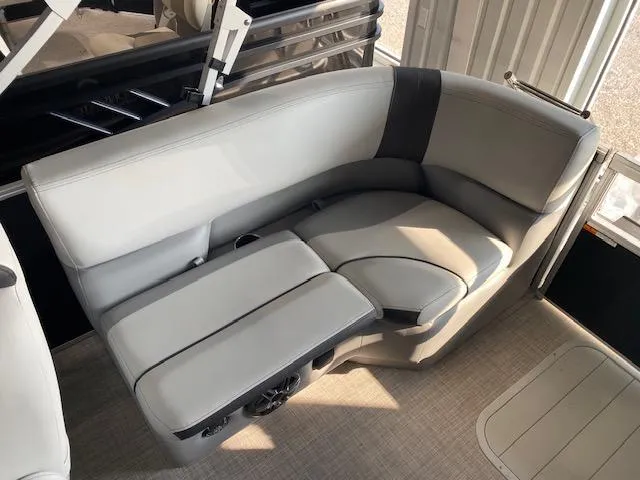 Slide: The Image of 2025 SunCatcher Select 320 RC boat interior with gray seating and cup holders. - 8