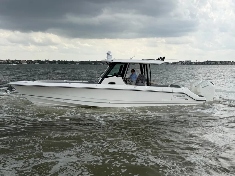 Slide: The Image of 2026 Boston Whaler 360 Outrage cruising on choppy waters. - 0