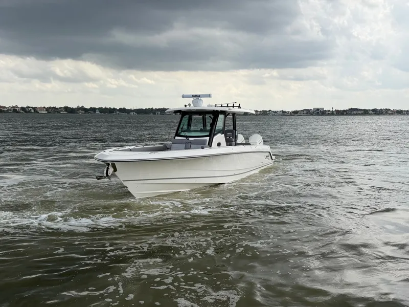 Slide: The Image of 2026 Boston Whaler 360 Outrage on choppy waters. - 2