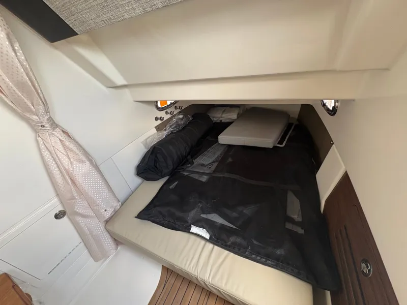 Slide: The Image of Interior of 2026 Boston Whaler 360 Outrage featuring cozy sleeping area. - 41