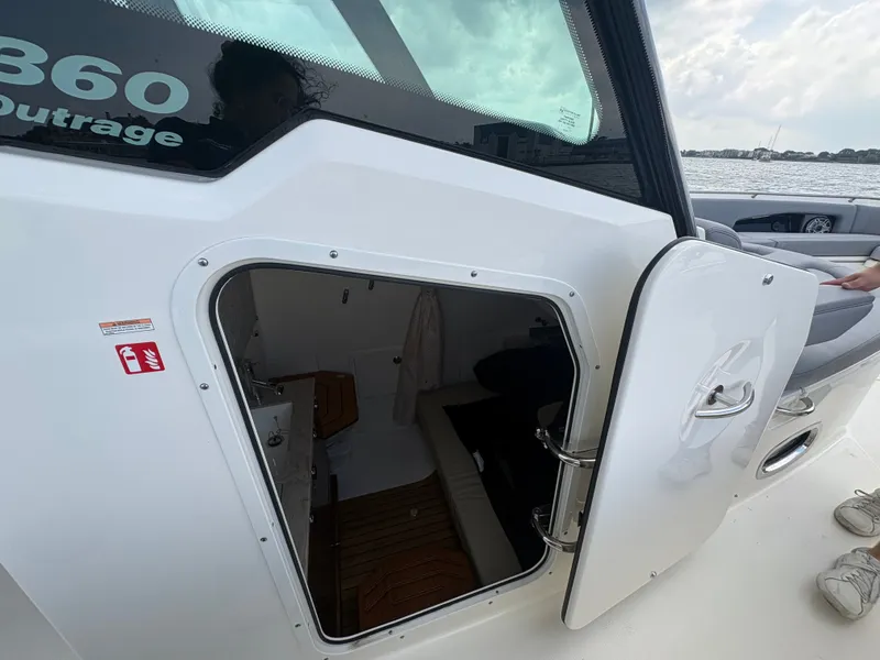 Slide: The Image of Boston Whaler 360 Outrage 2026 with open cabin door. - 44