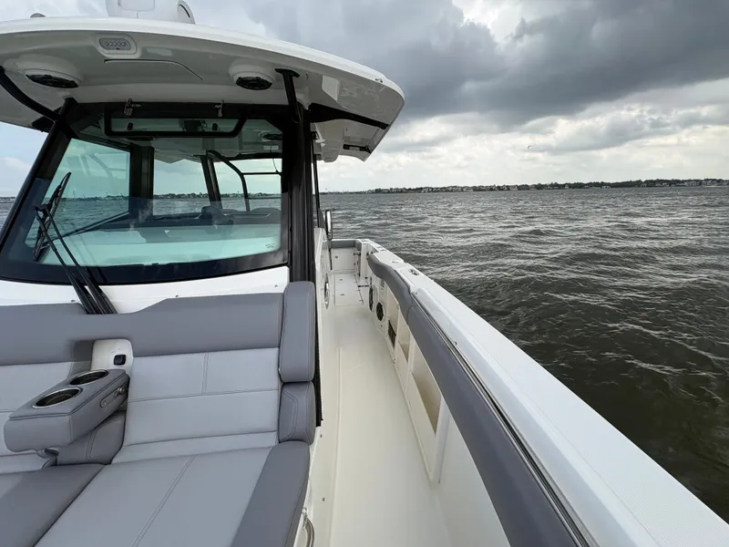 Slide: The Image of Boston Whaler 360 Outrage 2026 on choppy waters. - 48