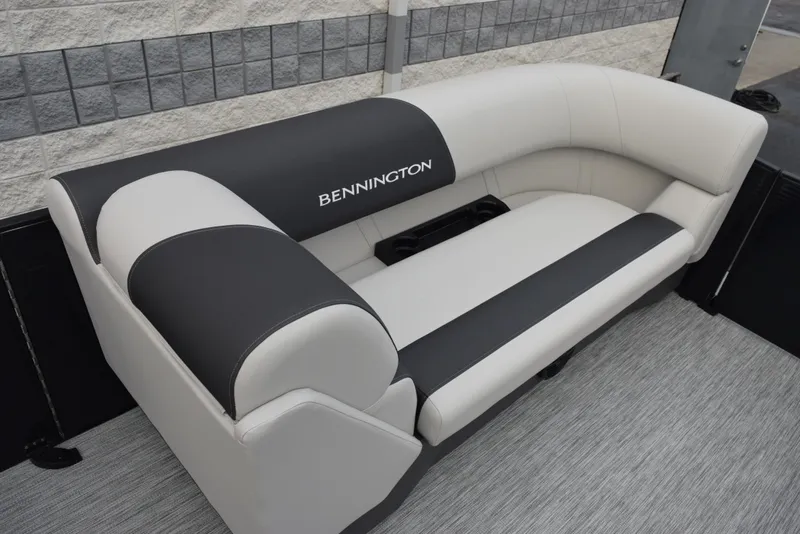 Slide: The Image of 2025 Bennington 21 SL boat seating with black and white upholstery. - 11