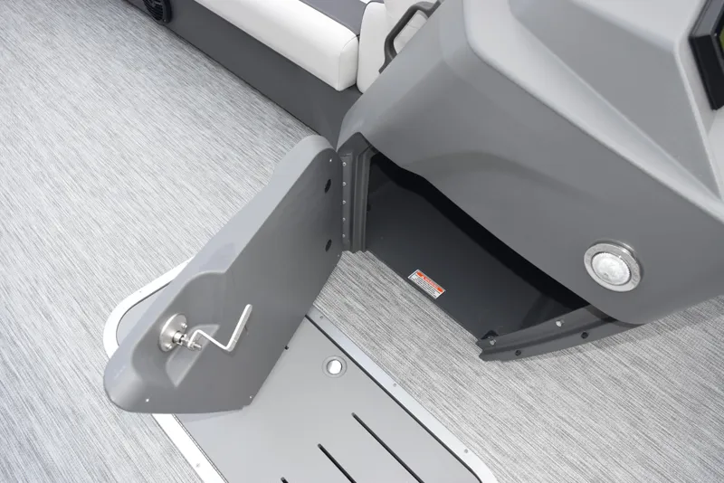 Slide: The Image of Open storage compartment on 2025 Bennington 21 SL boat, featuring sleek gray interior design. - 14