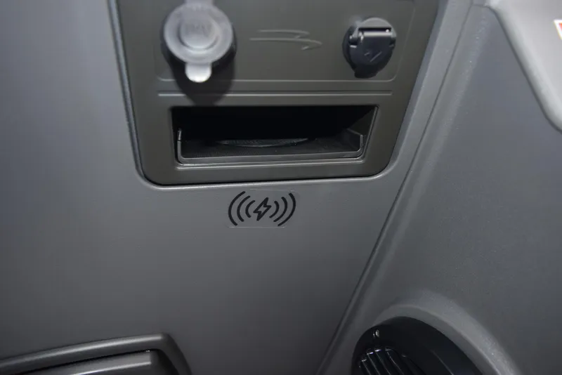 Slide: The Image of 2025 Bennington 21 SL dashboard with wireless charging symbol and power outlets. - 15