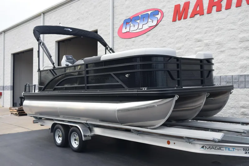 Slide: The Image of 2025 Bennington 21 SL pontoon boat on trailer outside GSPS Marine. - 2