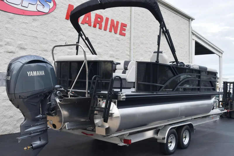 Slide: The Image of 2025 Bennington 21 SL pontoon boat with Yamaha engine on a trailer. - 4