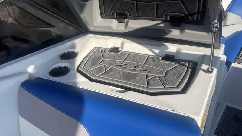 Slide: The Image of 2024 Tigé Z5 boat interior with cup holders and storage compartment. - 8