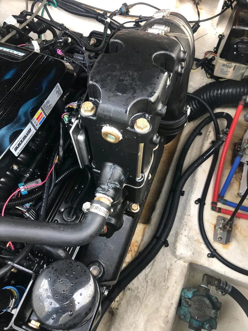 Slide: The Image of Engine compartment of a 2007 Sea Ray 240 Sundancer boat, showing detailed components and wiring. - 13