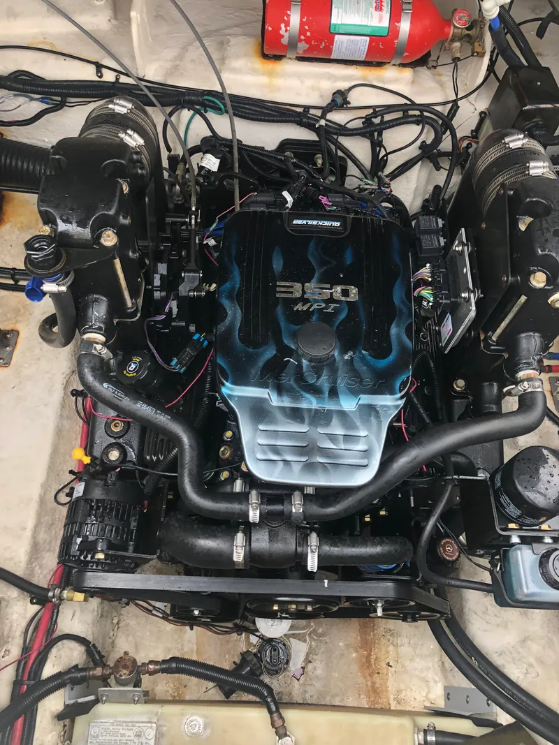 Slide: The Image of 2007 Sea Ray 240 Sundancer engine compartment with a 350 MAG MPI engine. - 14