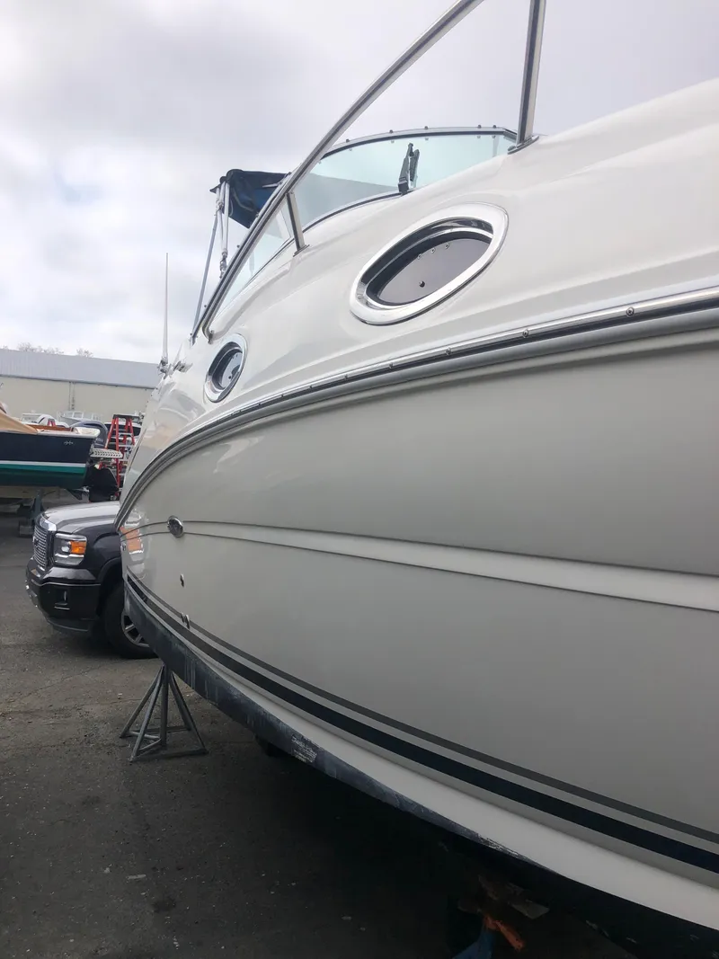 Slide: The Image of 2007 Sea Ray 240 Sundancer boat on a trailer, side view. - 16
