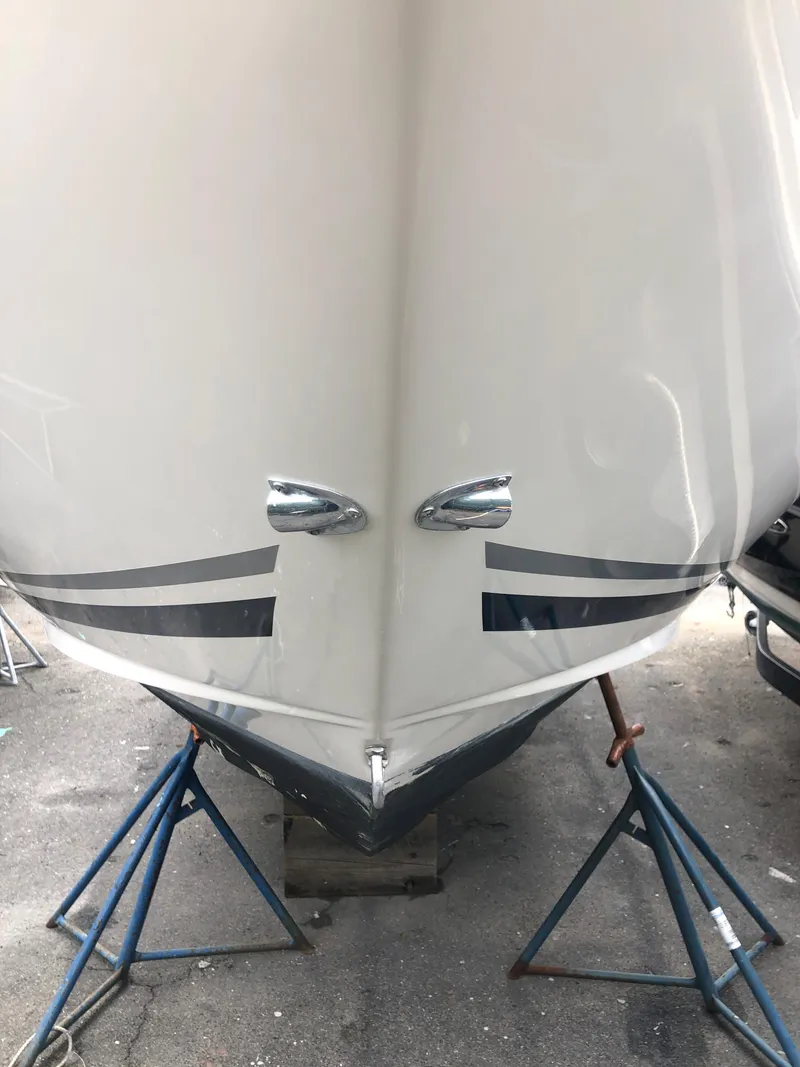 Slide: The Image of 2007 Sea Ray 240 Sundancer boat hull on stands, front view. - 2