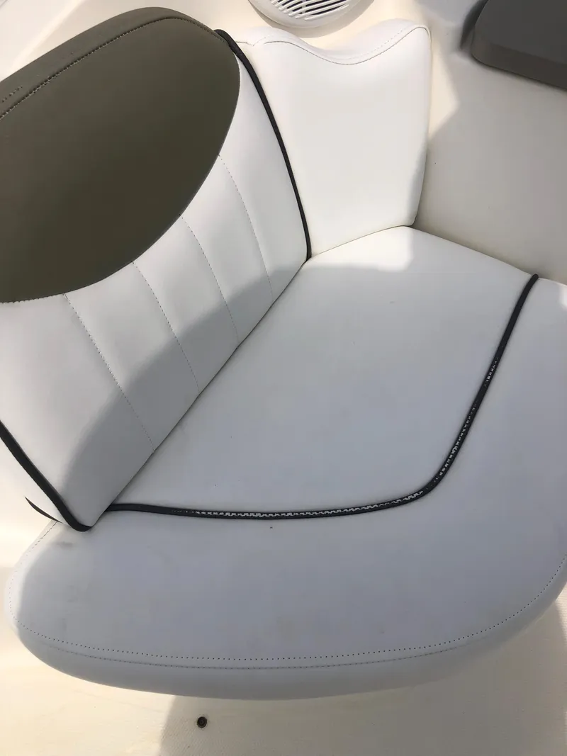 Slide: The Image of White seating on 2007 Sea Ray 240 Sundancer boat, featuring sleek design and comfortable upholstery. - 3